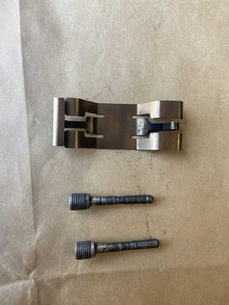 Pad retaining spring and pin