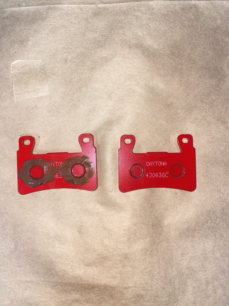 Photo of brake pad with brake grease applied